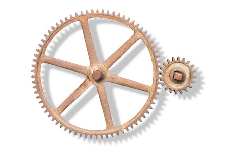 Rusty cogwheels with shadow on white backgroundの写真素材