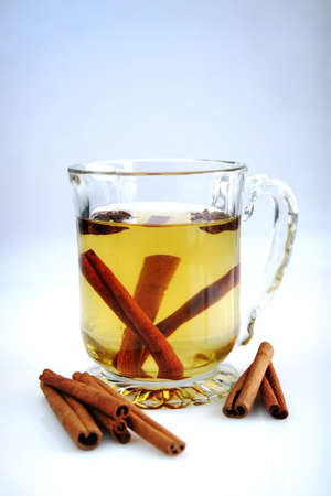 Apple juice with cinamone stick in a big and clear cupの写真素材