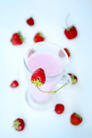 Top view of a strawberry smoothie and fresh fruitsの写真素材