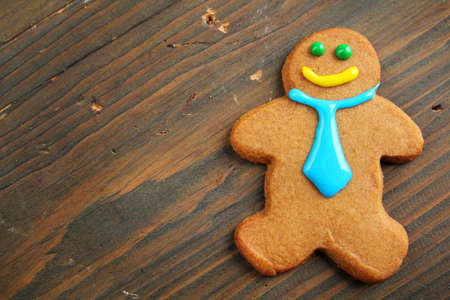 Business gingerbread with tie on a wooden tableの写真素材
