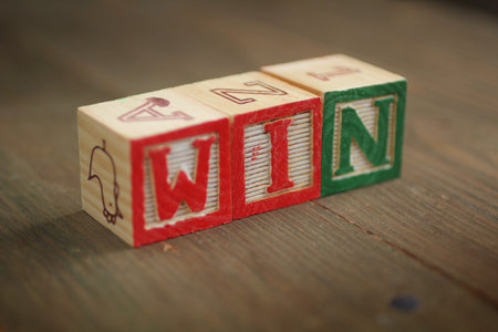 alphabet wood blocks forming the word win