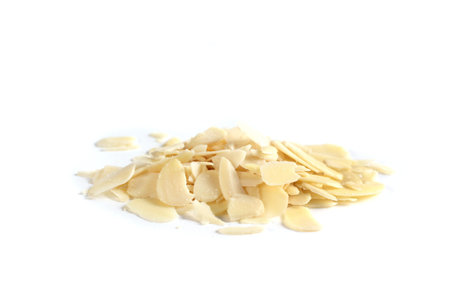 Sliced almonds put on a white backgroundの写真素材