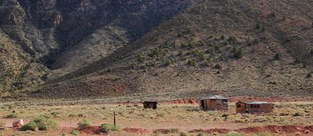 Wooden cabins with mountains in background in Arizona, USAの写真素材