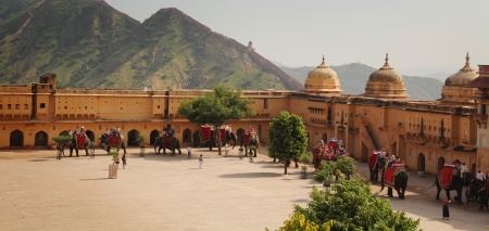 JAIPUR, INDIA - SEPT 29: Decorated elephant with tourists on back walk into Amber Fort on Sept 29, 2012 in Jaipur, Rajasthan, India. のeditorial素材