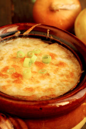 Close up of a french onion french soup in a ceramic bowlの写真素材