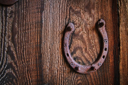 Rusted horseshoe on a wooden barn wallの写真素材