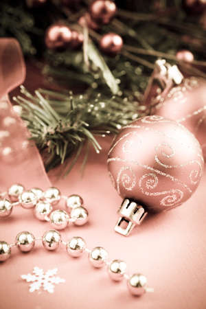 Christmas decoration with christmas balls, golden beads and branch of fir as ornamentsの写真素材