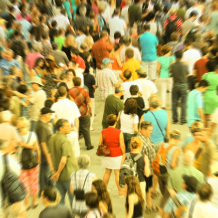 Blur background showing a crowd. Crossed process to look like an instant picture.