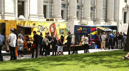 MONTREAL, CANADA - JULY 23, 2015: Food trucks are very popular in Montreal during summer time into the business area on july 23 in Montreal, Canada.のeditorial素材