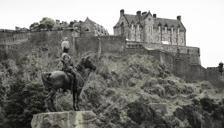 Equestrian monument to the Royal Scots Greys at the Princes Street Gardens with Edinburgh castle in backgroundのeditorial素材