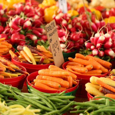 Colorful vegetables on a display in a marketの写真素材