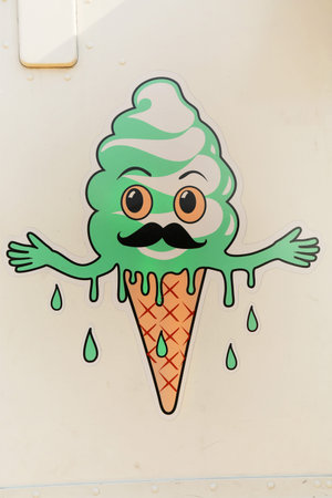 MONTREAL, CANADA,  JULY 3, 2015:  Graffiti of a ice sweating cream cone with mustachの写真素材