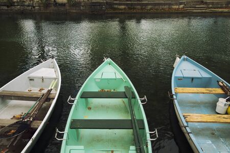 Detail of colourful rowing boats with oars, moored at the riverside in Annecy, Franceの写真素材