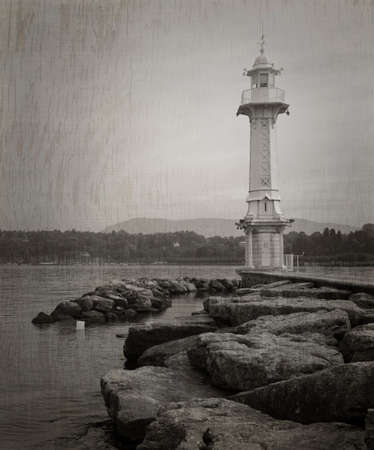 Les Paquis Lighthouse in Geneve, Switzerland in black and white with textureの写真素材