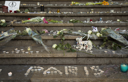 LYON-FRANCE NOVEMBER 15, 2015:  Offerings, toughts, flowers and candles on the steps of the town hall at Lyon, France about the terrorist bombing happens in France on 13th november 2015.のeditorial素材