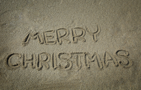 Merry christmas write in a sandの写真素材