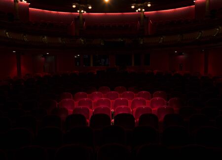 Follow spot on red seat in a generic theaterの写真素材