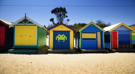 BRIGHTON-AUSTRALIA October 28, 2016: Colourful boxes in a row at Brighton beach in Victoria, Australiaのeditorial素材