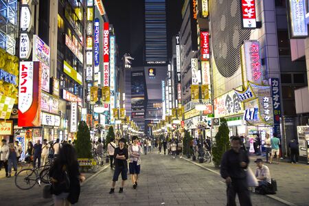 TOKYO-JAPAN, 19 June 2016:  Shinjuku street during magic hour and people crossing the street in Tokyo, Japanのeditorial素材