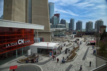 TORONTO-CANADA, 10 APRIL 2017:  View of the base of the 1,815.3 ft CN tower and Ripley's public aquarium of Toronto, Ontarioのeditorial素材