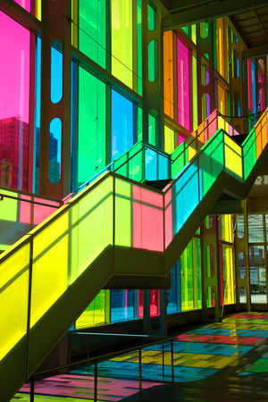 MONTREAL, CANADA - September 14, 2017: Colourful glass panels and stairs in Palais des congres de Montreal (Montreal Convention and Conference Centre)  Montreal, Canadaのeditorial素材