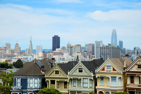 SAN FRANCISCO-USA, May 6, 2018:  Painted ladies are a designation for brightly painted Victorian and Edwardian buildings in San Francisco with downtown San Francisco in backgroundのeditorial素材