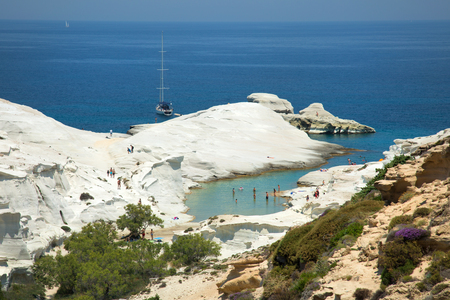 Sarakiniko  beach on Milos Island where waves driven by north winds shape the greyish-white volcanic rock into amazing shapes, and the area is often compared to moonscapeの写真素材