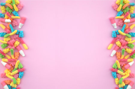 Different gummy candies on a pink backgroundの写真素材