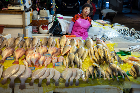 SEOUL-SOUTH KOREA, MAY 18, 2018: Woman at her booth at the fish market in south Korea. Noryangjin Fish Market is an extensive farmers market in Noryangjin-dongのeditorial素材