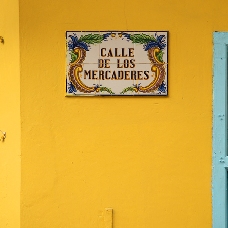 Street sign on a yellow wall in Havana Cuba,の写真素材