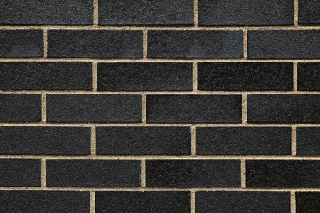 Mat brick wall paint with a dark grey with beige cementの写真素材