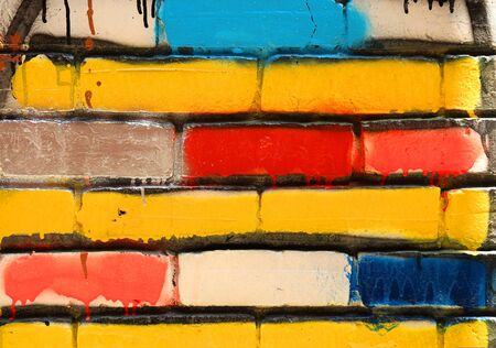 Mat brick wall paint with bright primary  coloursの写真素材
