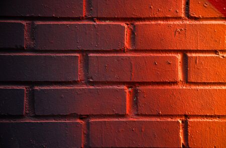 Mat brick wall paint in orange tone like a gradientの写真素材