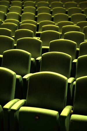 Side view of a green velvet seat in a theatre or a cinemaの写真素材