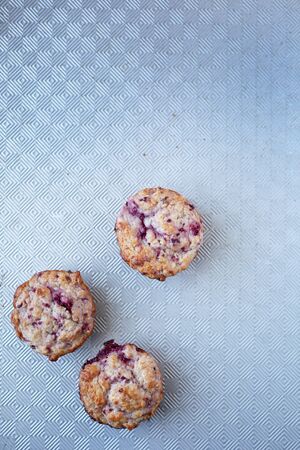 three warm and fresh handmade strawberry muffin ready to eatの写真素材