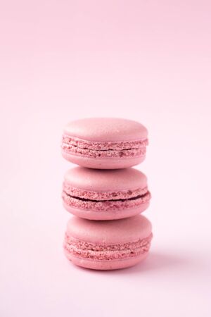 Stack of french traditional pink macarons on pinkの写真素材