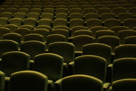 Side view of a green velvet seat in a theatre or a cinemaの写真素材