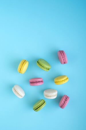 Top view of colorful french traditional macarons on blueの写真素材