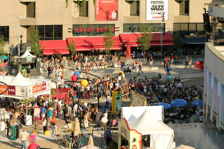 MONTREAL, CANADA - JUNE 29, 2012: People look at a show during the open-air concert at the 33th International Jazz Festival of Montreal on June 29, 2012 in Montreal, Canadaのeditorial素材