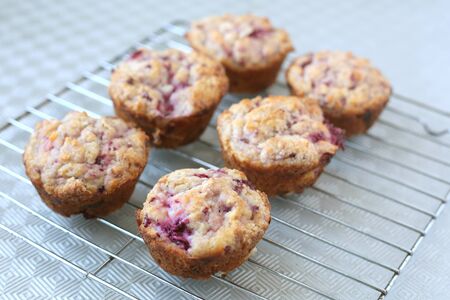 Warm and fresh handmade strawberry muffins on a grillの写真素材