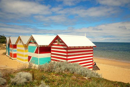 Colorful beach boxes at Brighton beach by a nice and warm summer day in Victoria in Australiaの写真素材