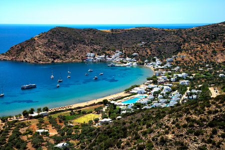 Beautiful view of Gialos beach and the blue ocean with sailing boats in Sifnos island in cycladic in Greeceの写真素材