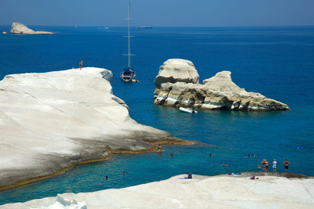MILOS, GREECE, june 26 2017: People swimming and sunbathing at sarakiniko beach, volcanic beach in Milos Island in Greece. Sarakiniko is one of the most photographed landscapes in the Aegeanのeditorial素材