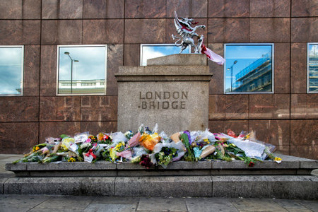 LONDON, UK - JUNE 7, 2017: Floral tributes laid at the site of the London terrorist attack at London Bridge on the 3rd of june 2017.のeditorial素材