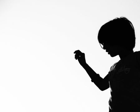 A silhouette makeing a gesture の写真素材