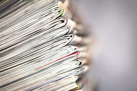 closeup stack of newspaperの写真素材