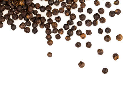 closeup the dried black pepper on white backgroundの写真素材