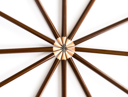 brown wooden pencil arrange as circular on the white backgroundの写真素材