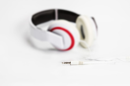 selective focus on audio plug of headphones on white backgroundの写真素材