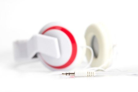 selective focus on audio plug of headphones on white backgroundの写真素材